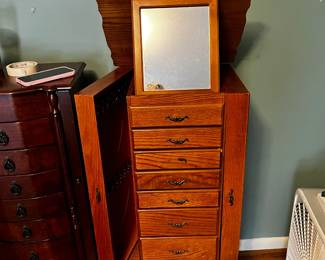 #233 Oak Jewelry Armoire (finish issues on top) w/2 side open door and flip-up top w/prop up vanity style mirror w/8 drawers - on legs - 18x15x41 $65.00