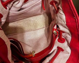 #197 Dooney & Bourke Red Leather Shoulder Bag. J6740836 Excellent Exterior Condition. Slight Staining on Bottom of Interior $45.00