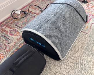 Under desk heated foot rest, camera bag
