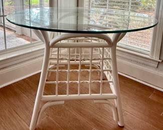$140 glass top round rattan table