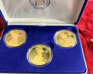Three reproduction coins, two of them are 1 ounce of pure silver each