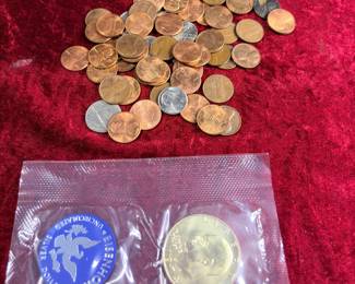 Collection of wheat and memorial pennies with a 40% silver Eisenhower dollar