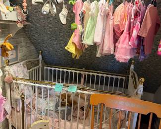 Vintage iron crib and baby clothing 