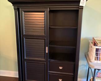 nice bookshelf, display with sliding door