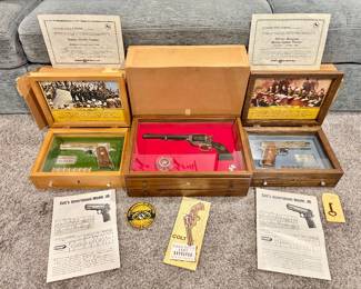 1970s Colt commemorative pistols: WWII Asiatic-Pacific Theater Govt model .45, Texas Ranger revolver, and WWII African-European-Middle Eastern Theater Govt. model .45