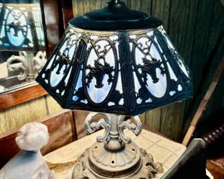 Slag glass table lamp (blue glass, bulb is on)