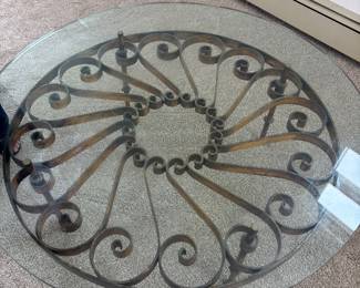 MCM round glass and wrought iron coffee table