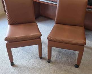 42  Pair of Tan Faux Leather Armless Chairs with Casters