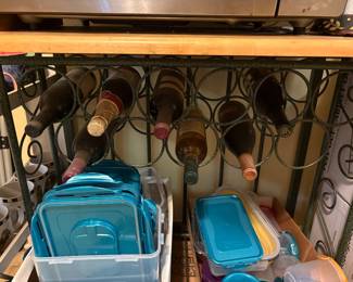 6 bottles of wine in holder attached to bottom of above shelf, plastic containers & lids