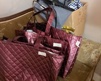 Various bags and other items on sofa
