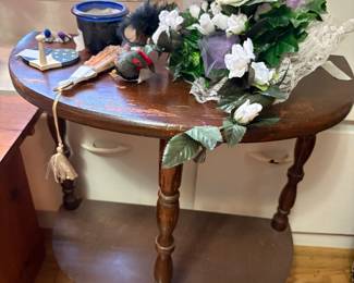 Round table with miscellaneous items on top