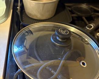 Large skillet lid & small metal pan in kitchen
