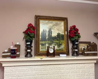 Various items on top of fireplace