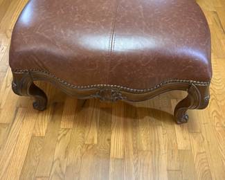 Leather covered stool in living room