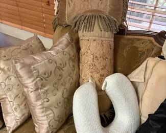 Close up of various pillows on sofa