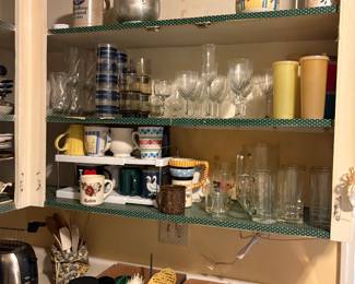 Cabinet items and on counter to left of sink