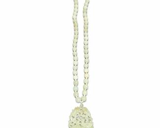 Pale Green Bead Necklace with Carved Bird Pendant