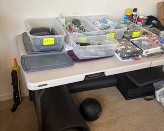 Assorted Hardware On Folding Table