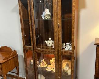Curved glass china hutch.