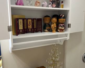Kokeshi dolls and glassware.