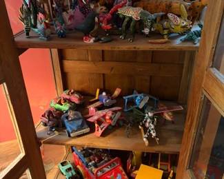 Display cabinet filled with alebrijes (Mexican folk art carved and painted figures)