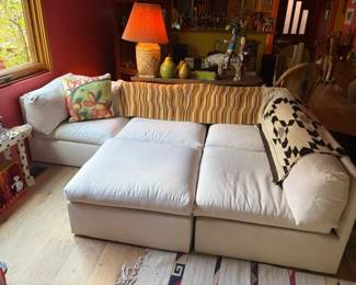 Upholstered sectional sofa and weavings
