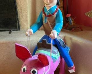 Delbert Buck Navajo man riding pig