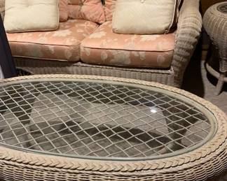 wicker loveseat and coffee table