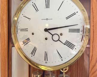 Howard Miller Oak Triple-Chime Grandfather Floor Clock with Brass Pendulum & Roman Numeral Dial