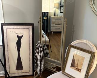 Another view of the accent chair, floor mirror and artwork