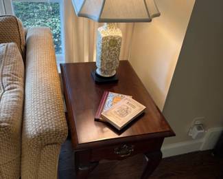 Matched set of side tables with drawers and porcelain lamps