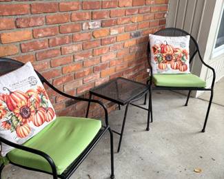 Black patio chairs with side table