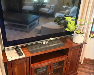 Media Console and shown with Sharp TV