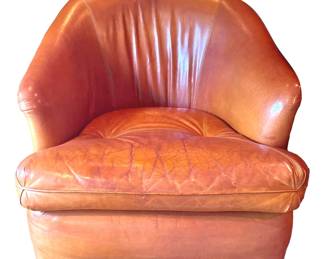 One of a pair of saddle leather SWIVEL chairs