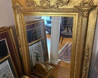 Ornate gold gilt wall mirror with carved floral frame