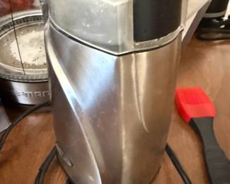 Stainless steel electric coffee grinder with attached cord