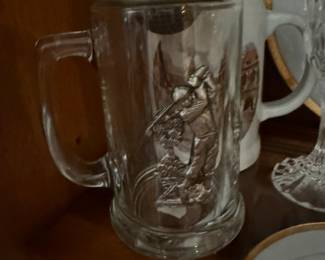 Glass beer stein with pewter golfer relief and rim