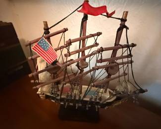 Wooden tall ship model with rigging and American flag