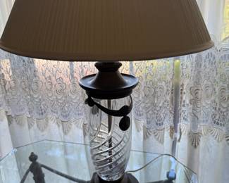 Cut glass swirl table lamp with bronze base and cream shade