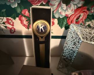 Kiwanis International letter opener with round enamel emblem