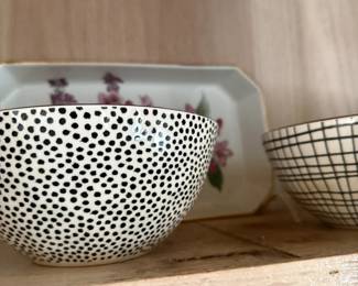 Black and white polka dot ceramic bowl with grid bowl and floral tray