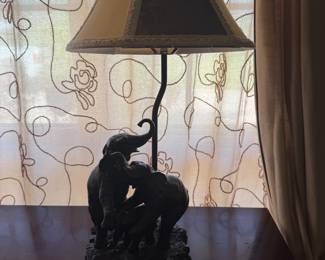 Table lamp with sculpted elephant family base and scalloped shade