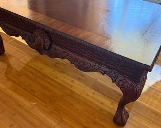 Carved mahogany coffee table with shell motif and claw feet