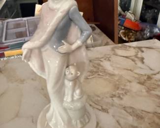 Porcelain lady figurine with dog, pastel glaze finish