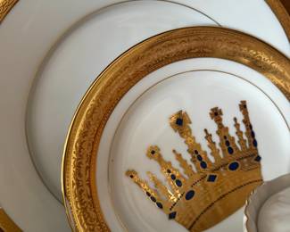 Gold rimmed china plates with painted crown design