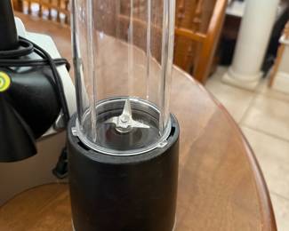 Personal blender with cup and cutting blade attachment