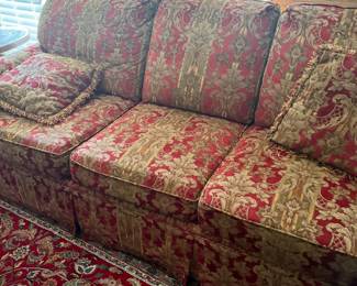 Three-cushion sofa in red and gold damask upholstery