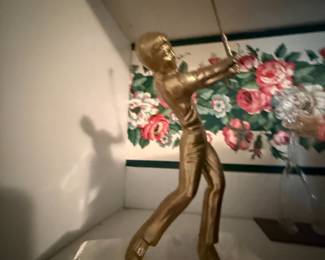 Gold tone golfer figurine mid swing pose