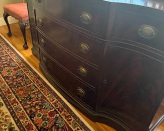 Mahogany bow-front sideboard with drawers and side cabinet doors