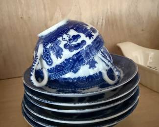 Blue willow china teacups and saucers, stacked set